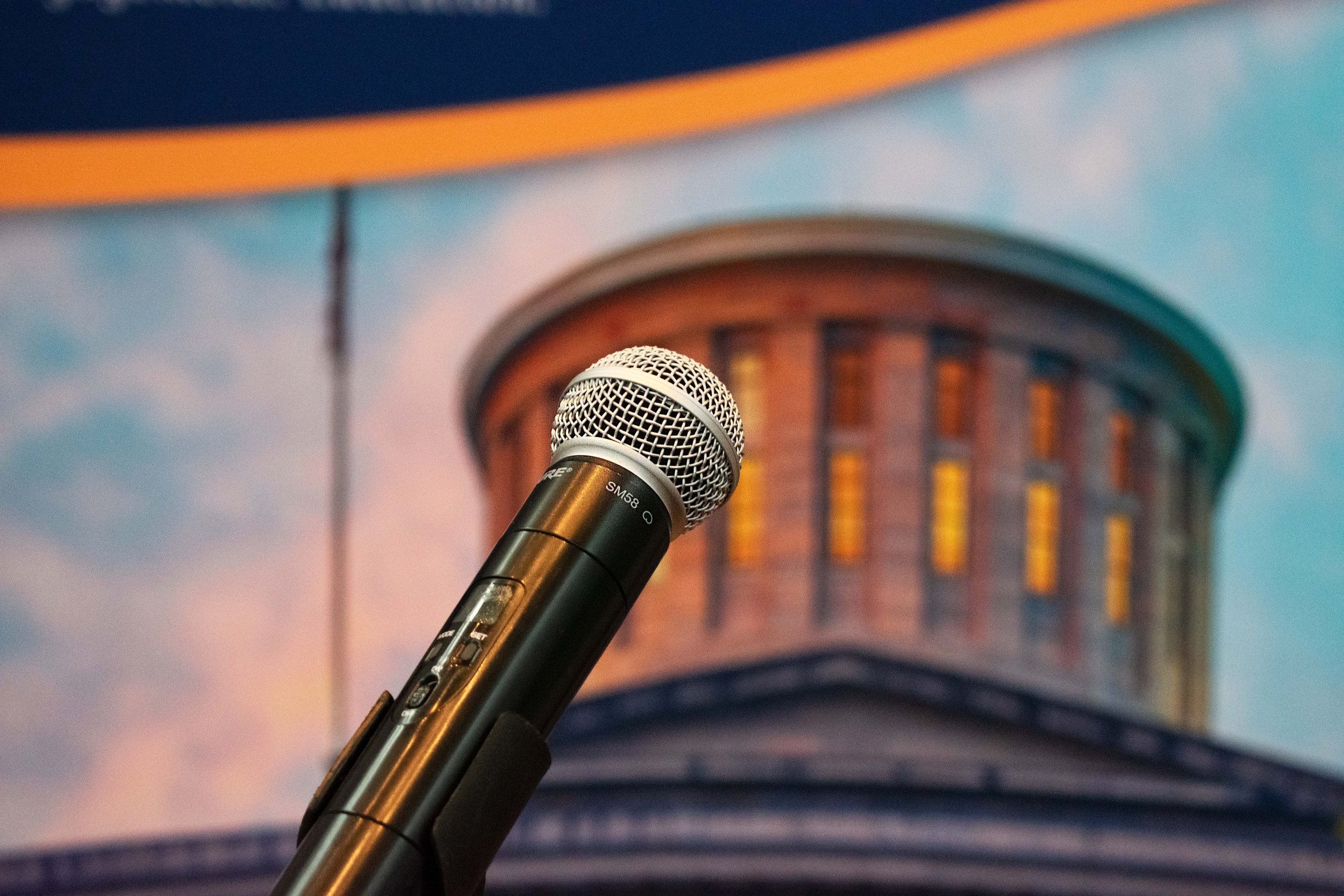 A microphone in front of the Ohio Statehouse